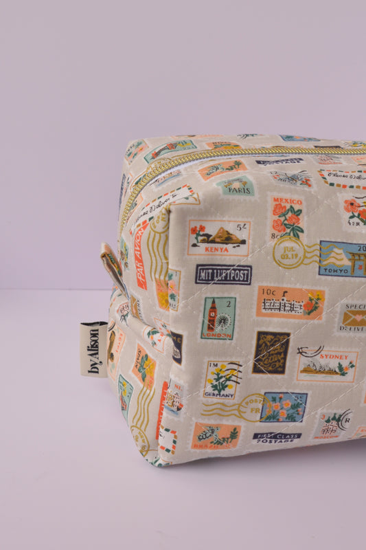 Travel Stamps Boxy Makeup Bag in Tan