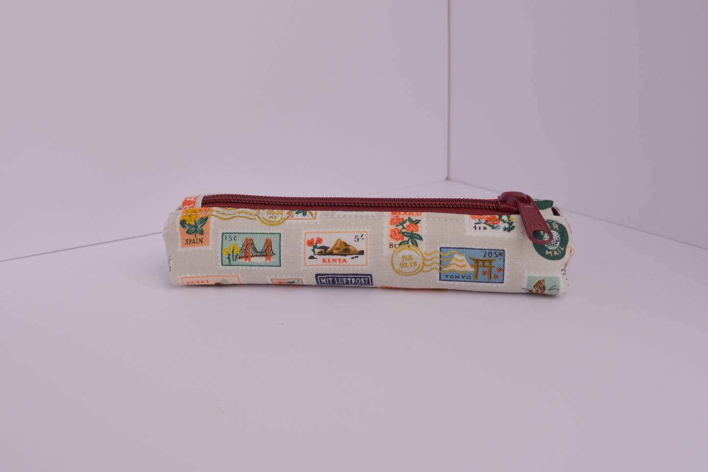 Small Pencil pouch in Tan Travel Stamps