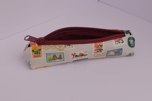 Small Pencil pouch in Tan Travel Stamps