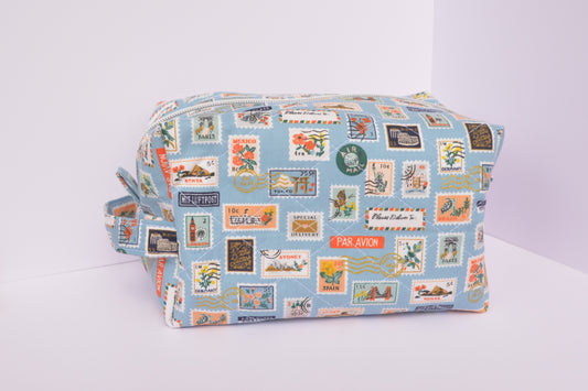 Travel Stamps Boxy Makeup Bag in Light Blue