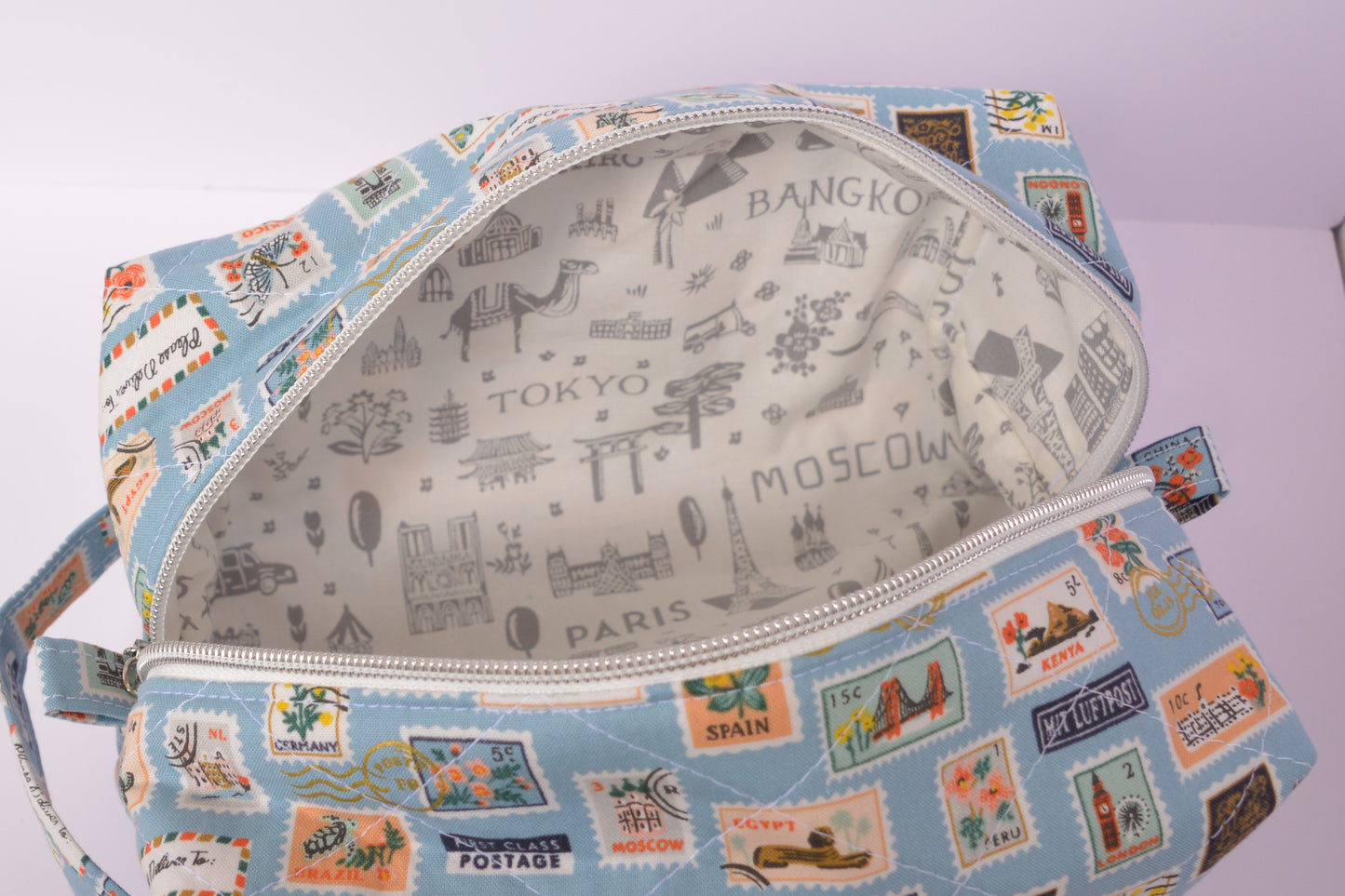 Travel Stamps Boxy Makeup Bag in Light Blue