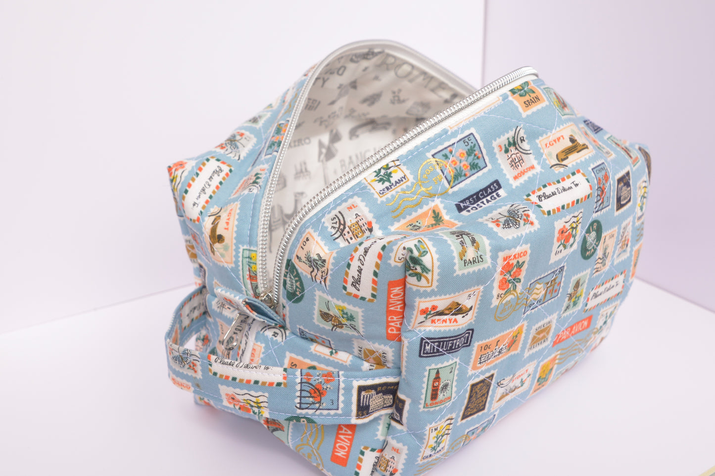 Travel Stamps Boxy Makeup Bag in Light Blue