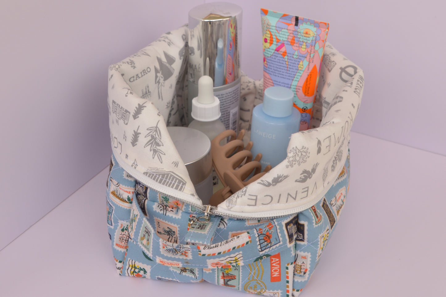 Travel Stamps Boxy Makeup Bag in Light Blue