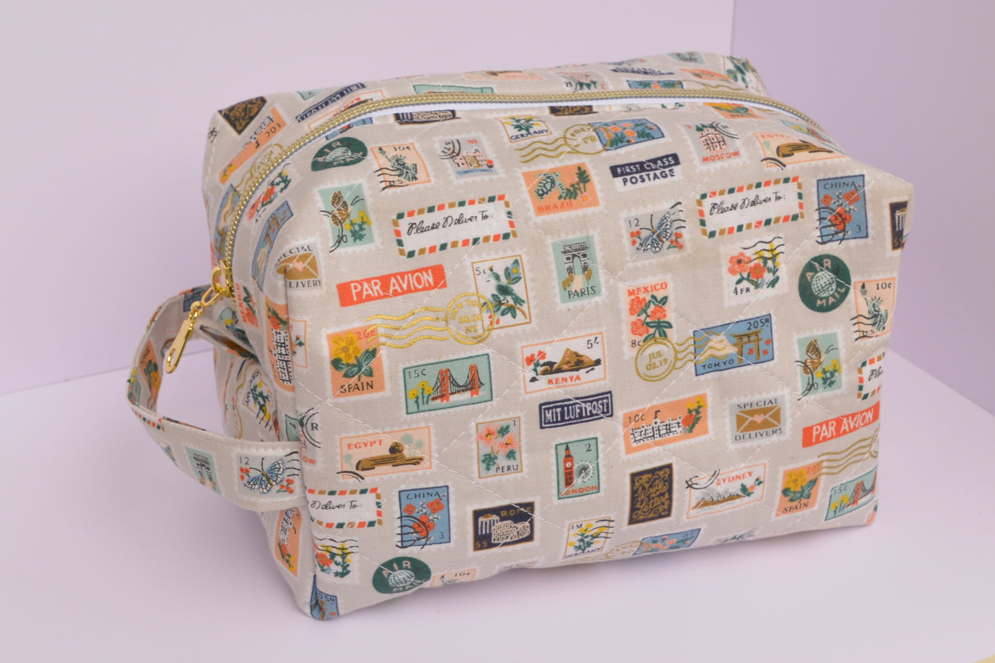 Travel Stamps Boxy Makeup Bag in Tan