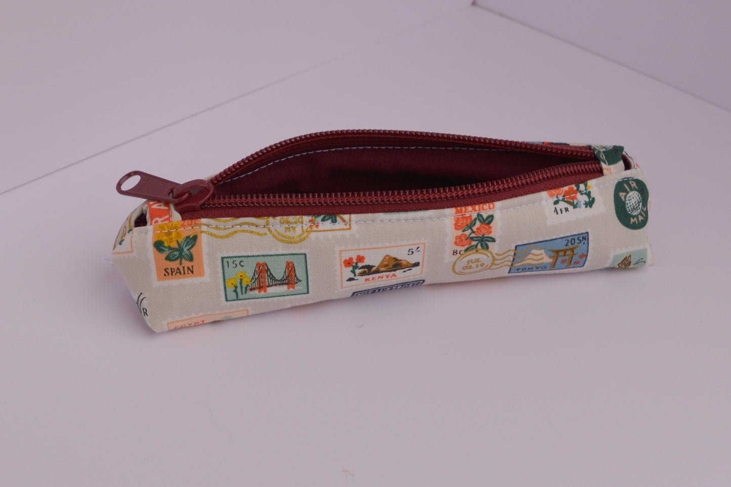 Small Pencil pouch in Tan Travel Stamps