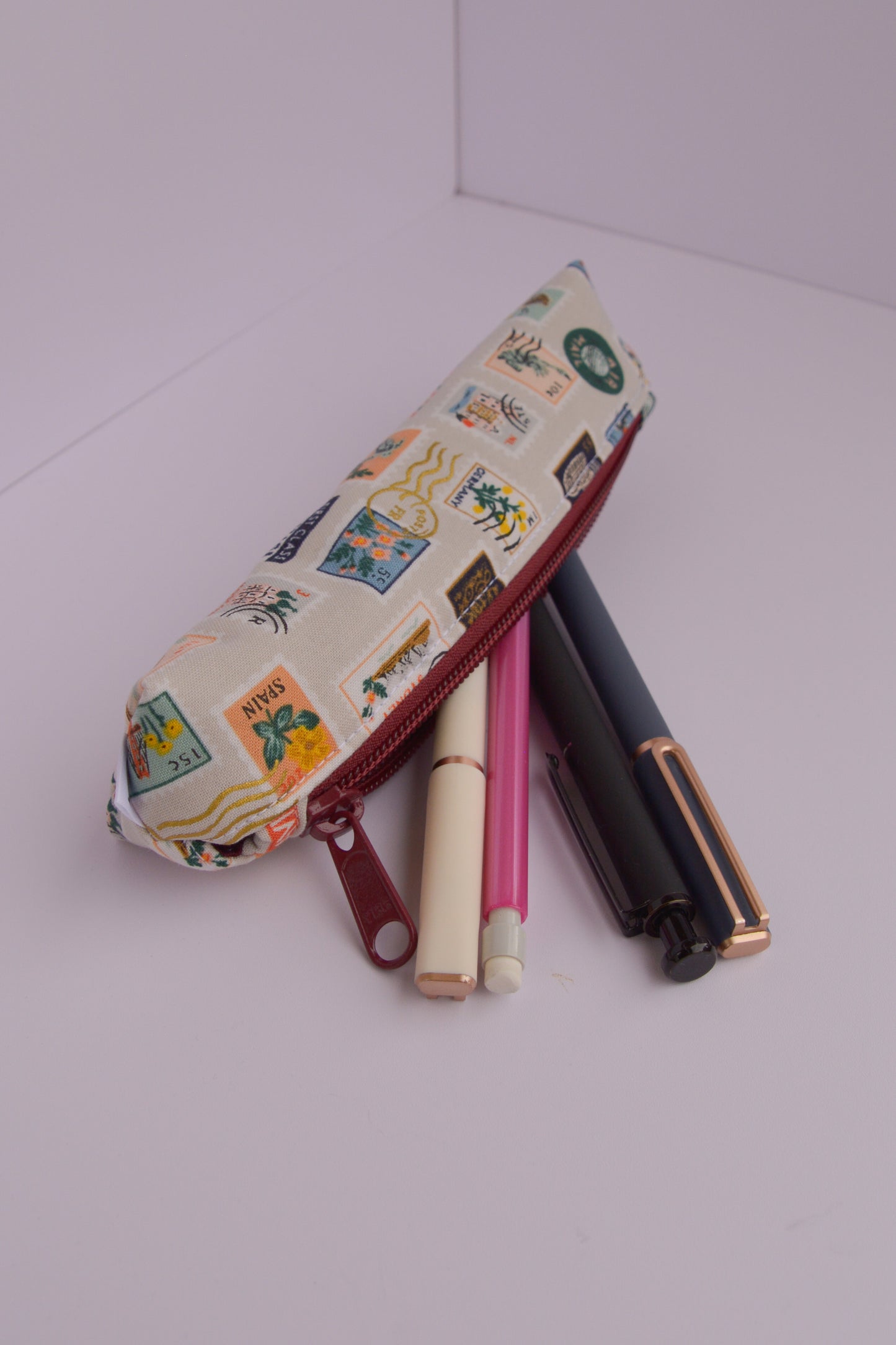 Small Pencil pouch in Tan Travel Stamps