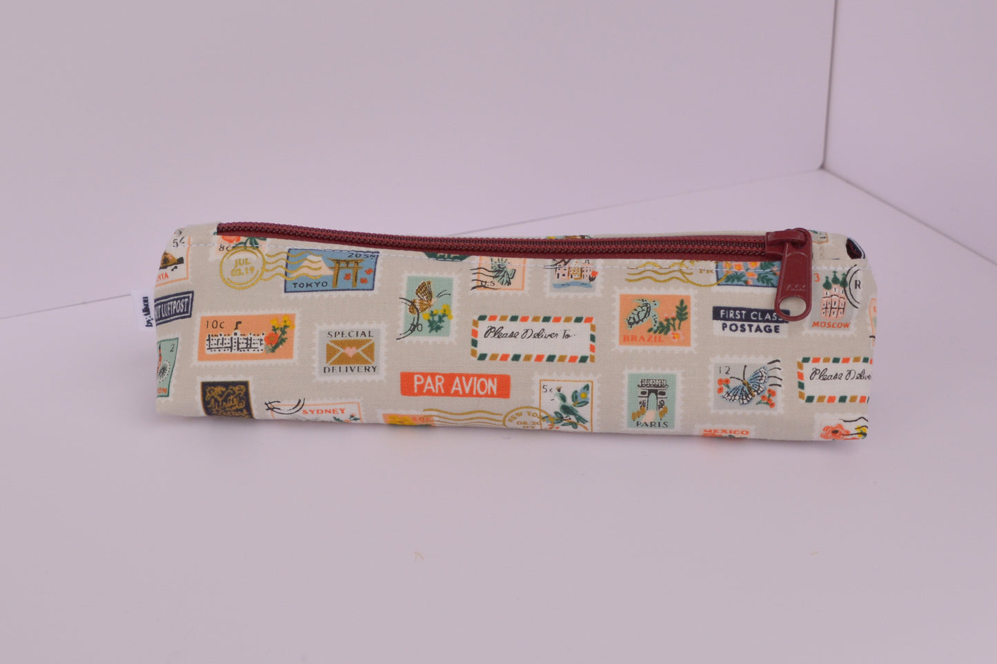 Large Pencil pouch in Tan travel stamps
