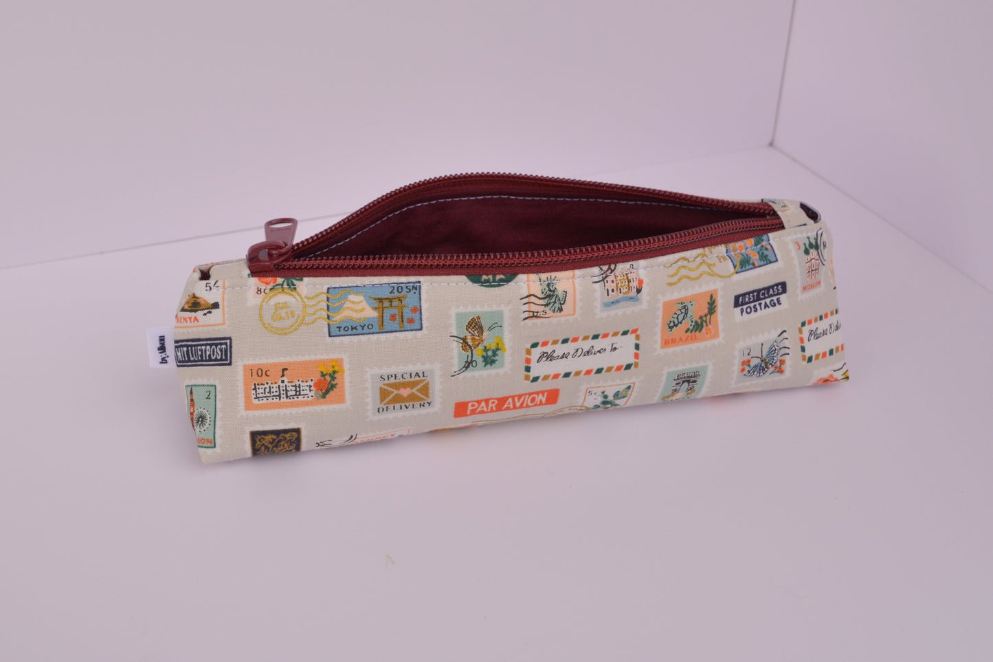 Large Pencil pouch in Tan travel stamps