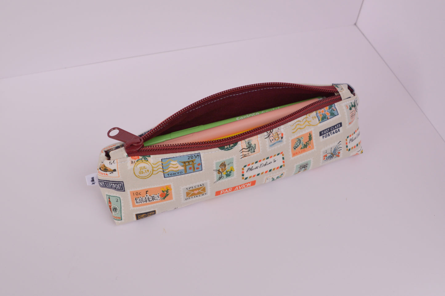 Large Pencil pouch in Tan travel stamps